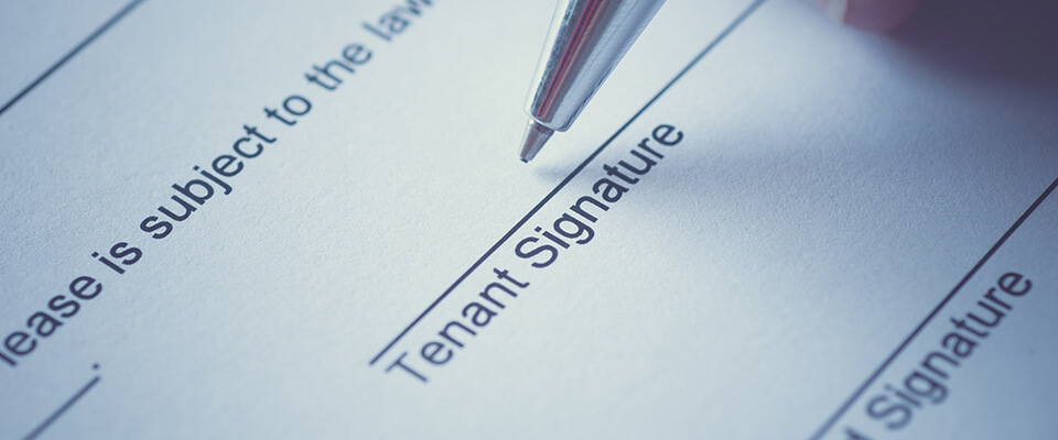 Tenant signing lease agreement